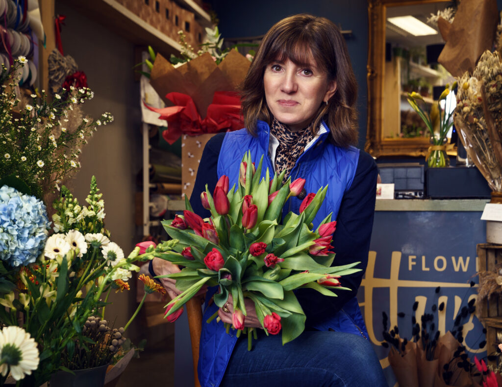florist holding a bunch of tulips