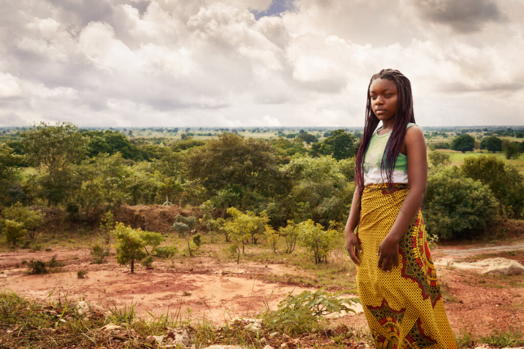 young woman looking out over landscape